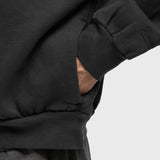 Fear Of God Essentials vintage black zip-up hoodie with logo, casual apparel featuring a classic design and front zipper.
