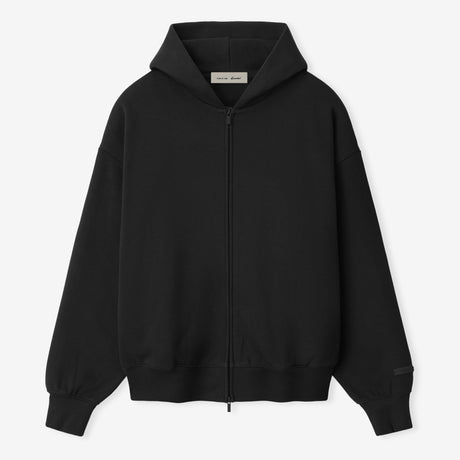 Fear Of God Essentials black and white zip-up hoodie with logo, casual apparel featuring a front zipper and hood.