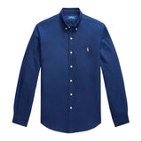 Navy Polo Ralph Lauren classic fit long sleeve Oxford shirt, button-down collar, and chest pocket, displayed on a hanger.