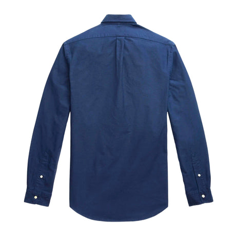 Navy Polo Ralph Lauren classic fit long sleeve Oxford shirt displayed on a hanger, showcasing button-down collar and chest pocket.