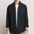 Black Polo Ralph Lauren classic fit Oxford long sleeve shirt displayed on a hanger, showcasing button-down collar and tailored fit.