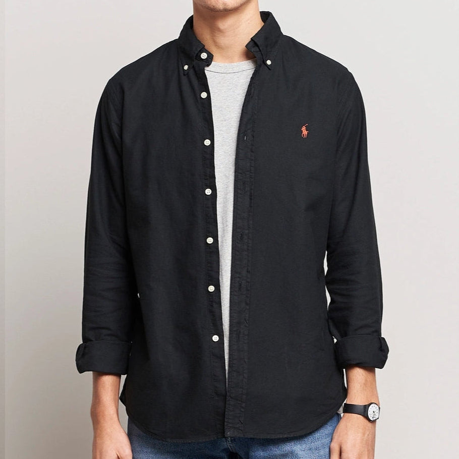 Black Polo Ralph Lauren classic fit Oxford long sleeve shirt displayed on a hanger, showcasing button-down collar and tailored fit.