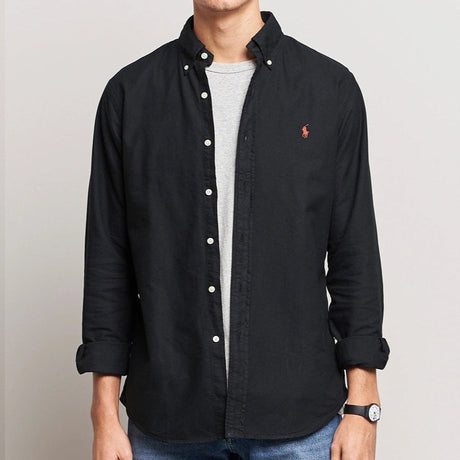 Black Polo Ralph Lauren classic fit Oxford long sleeve shirt displayed on a hanger, showcasing button-down collar and tailored fit.