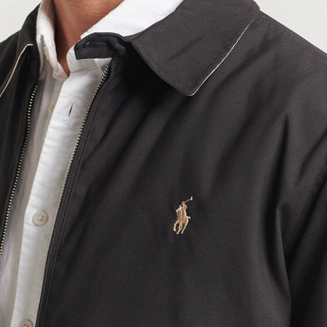 Black Polo Ralph Lauren Bi-Swing Harrington Jacket displayed on a hanger, showing the classic style and detailed design features.