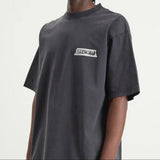Black Balenciaga Masking Tape Tee shirt with graphic design, showcasing a casual, stylish apparel piece from the luxury brand.