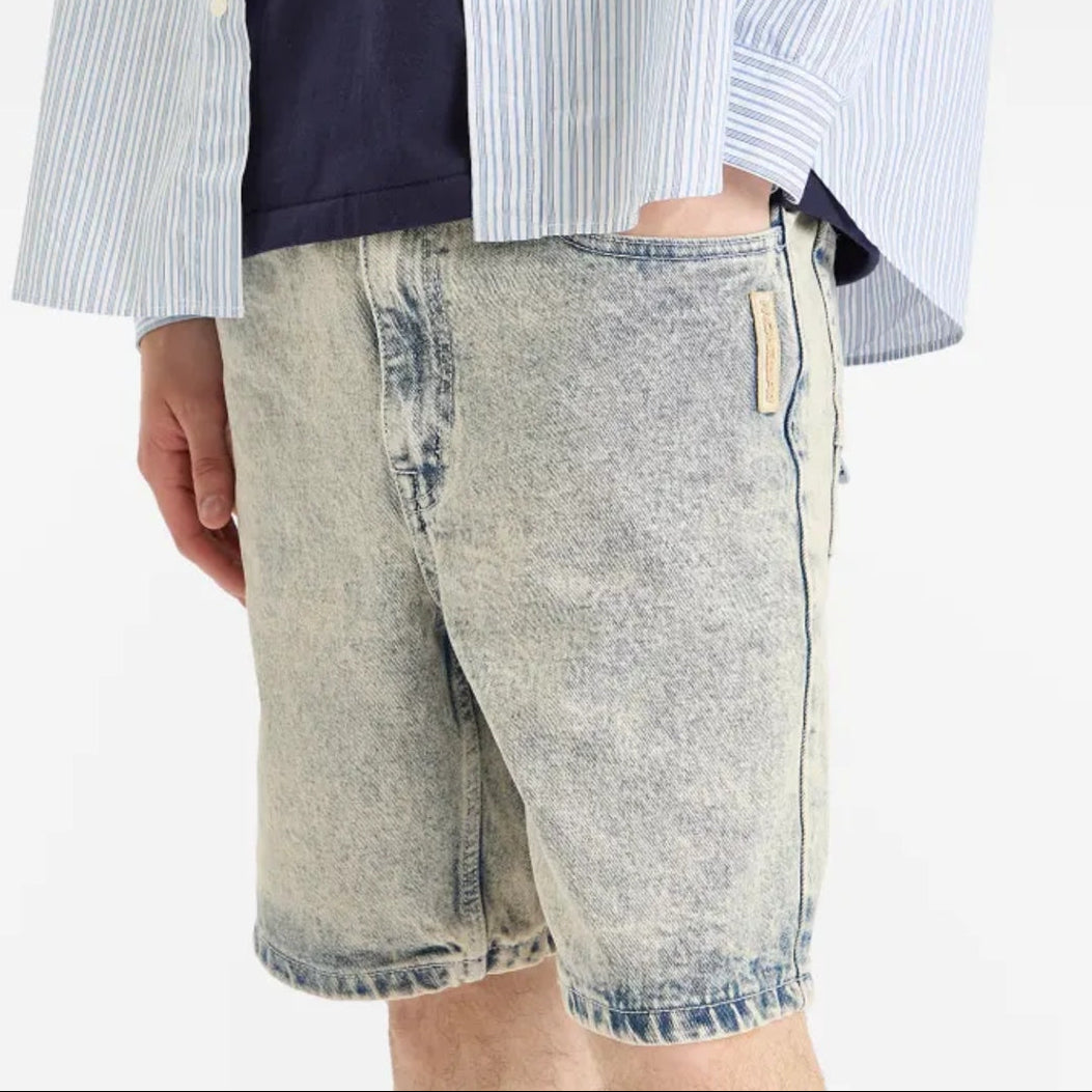 AAPE by Bathing Ape loose fit denim shorts with faded wash and classic five-pocket design, displayed on a plain background.