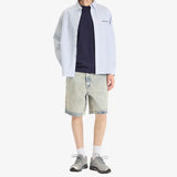 AAPE By Bathing Ape loose fit denim shorts with distressed details and brand logo patch on the back, casual men's apparel.