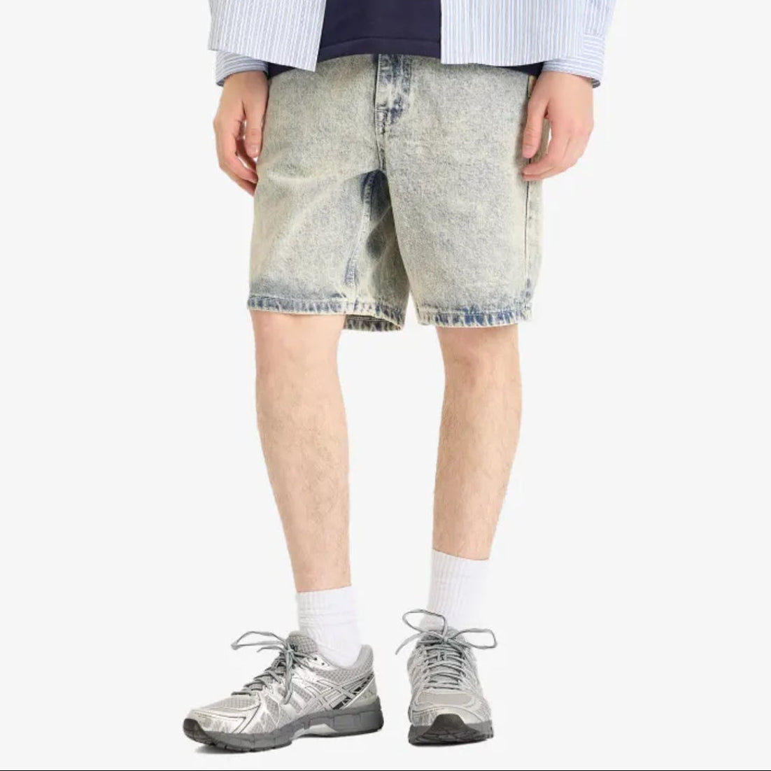 AAPE by Bathing Ape loose fit denim shorts with distressed details and classic five-pocket design on a plain background.