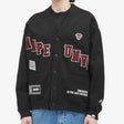 AAPE by BATHING APE UNVS cardigan, stylish knitwear, featuring the brand's logo and a modern design, displayed on a mannequin.