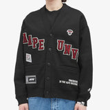 AAPE by BATHING APE UNVS cardigan, stylish knitwear, featuring the brand's logo and a modern design, displayed on a mannequin.