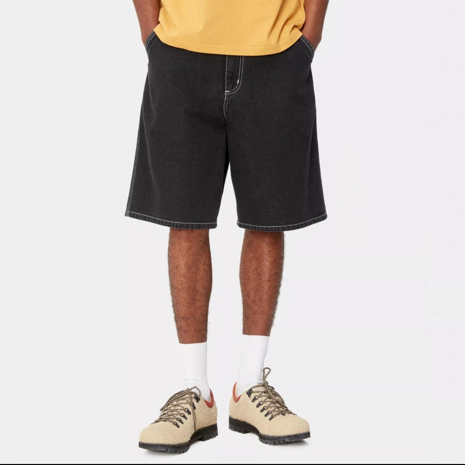 Black Carhartt WIP denim shorts with heavy stone wash finish, casual and durable apparel for everyday wear.