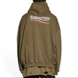 Balenciaga khaki hoodie with bold political campaign embroidery, oversized fit, casual streetwear style.