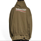 Balenciaga khaki hoodie with bold political campaign embroidery, oversized fit, casual streetwear style.