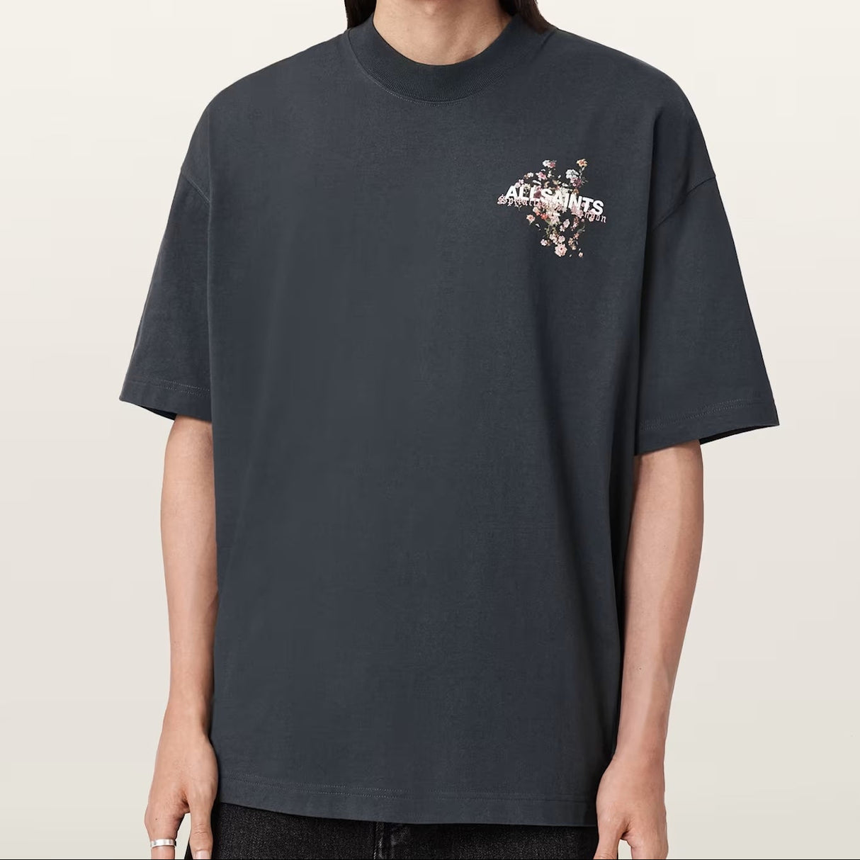 AllSaints Valen Tee in washed black, casual apparel featuring a relaxed fit and logo detail, displayed on a plain background.