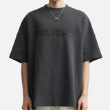 Fear of God Essentials Reflective Logo Ponte 90s Tee in iron dark grey, showcasing the soft fabric and reflective logo design.