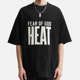 Fear of God Essentials X HEAT NBA 90s heavyweight black T-shirt, casual apparel with bold graphic design, front view.