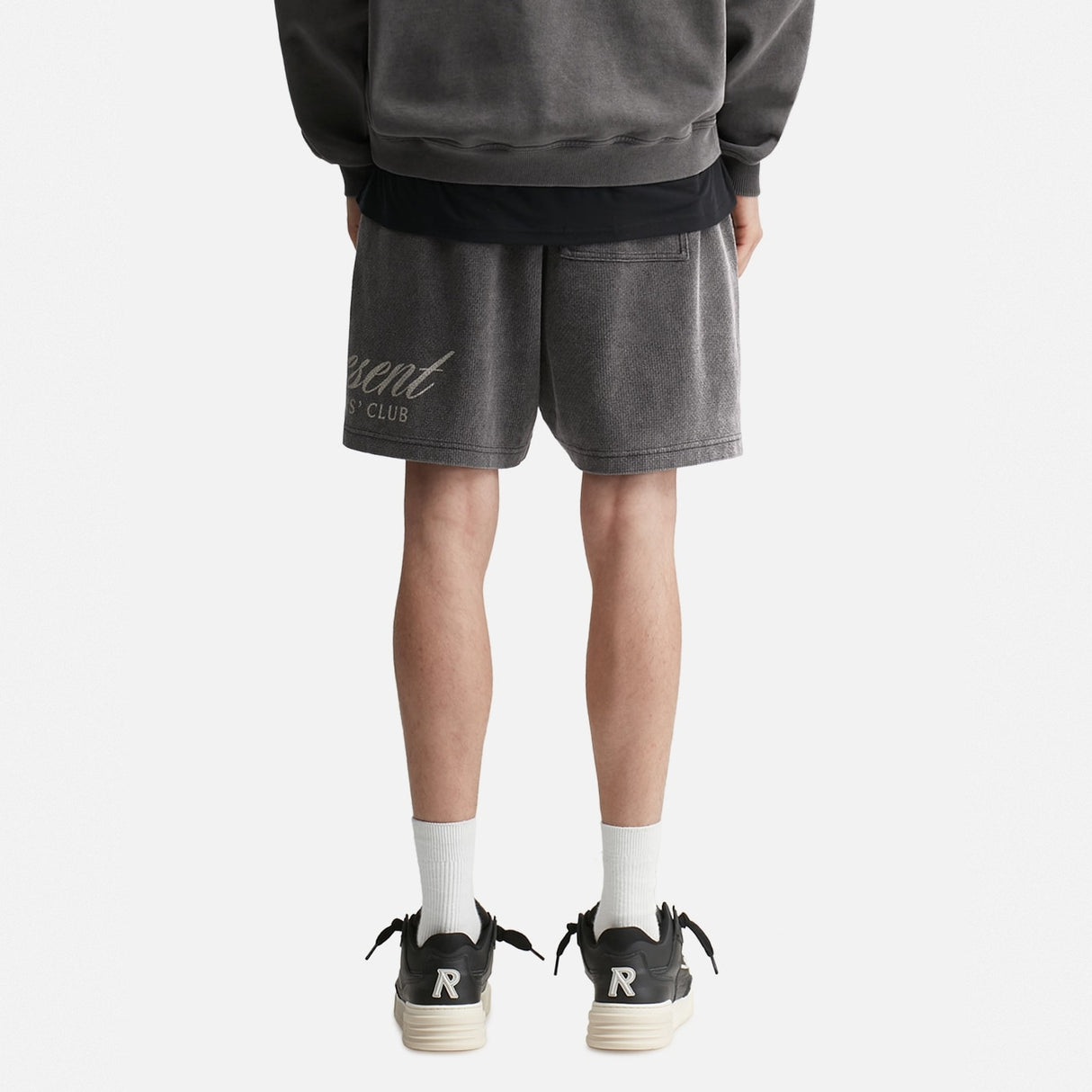 Represent Script Sweat Shorts in vintage black, featuring a casual fit and script logo design, perfect for comfortable streetwear.