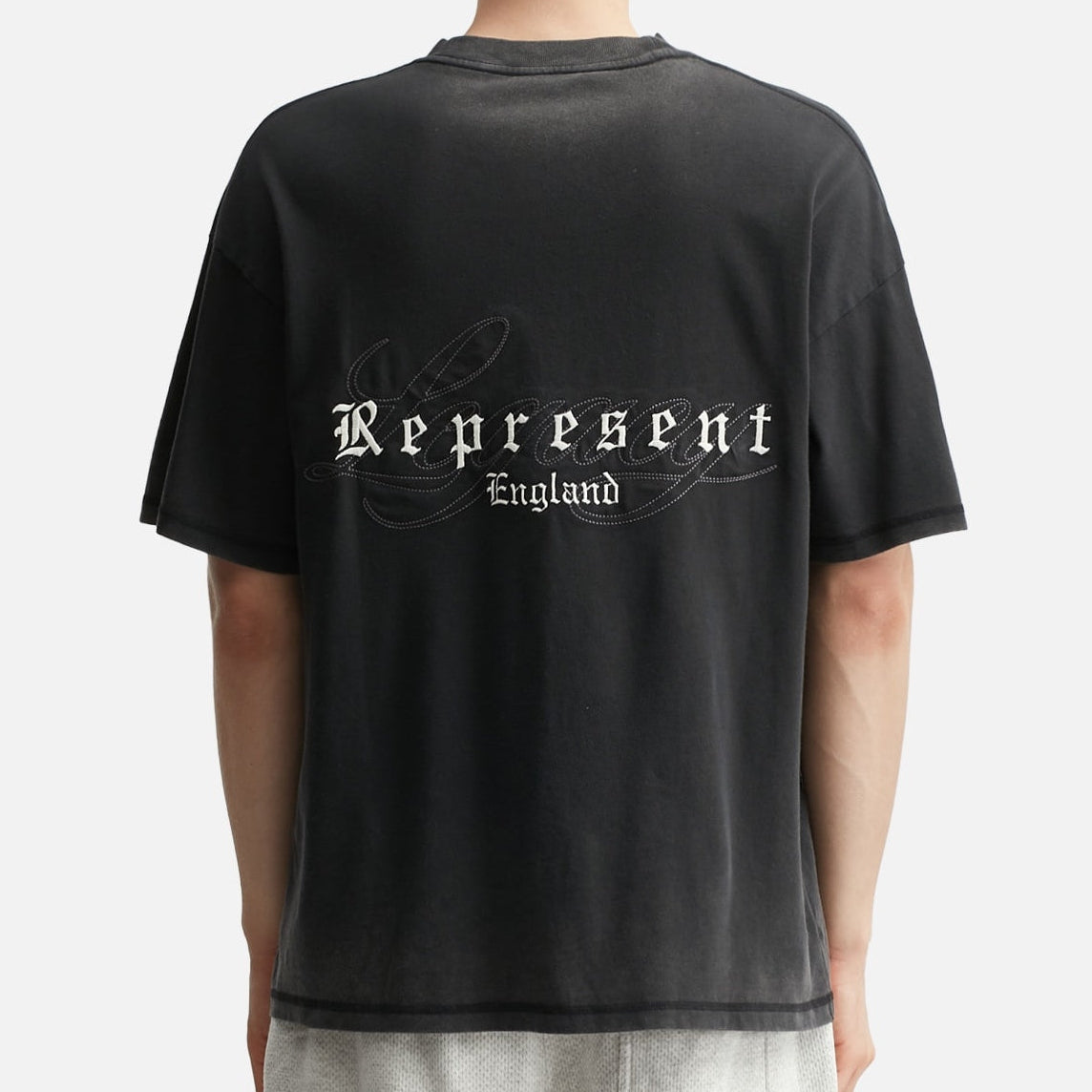 Black Represent Legacy Overprint Tee with graphic design, casual men's T-shirt made of soft cotton fabric.