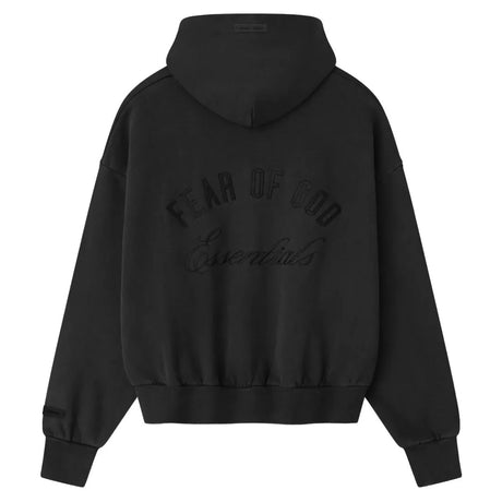 Fear Of God Essentials zip-up hoodie in vintage black with logo, displayed on a clean background, showcasing its classic style.