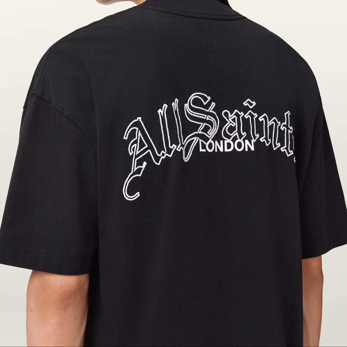 Black AllSaints Descent Embroidered Logo Tee, casual short-sleeve t-shirt with embroidered logo, on a plain background.