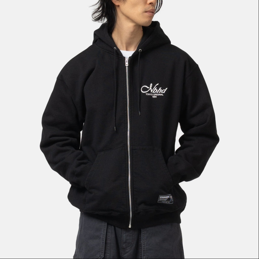 Black Neighborhood Staple Zip Hoodie, casual apparel with a front zipper and hood, featuring the NEIGHBORHOOD brand logo.