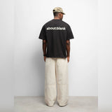 Black AboutBlank Reverse Blank Tee, casual black T-shirt with minimal design, made by ABOUT:BLANK, shown in a square image.