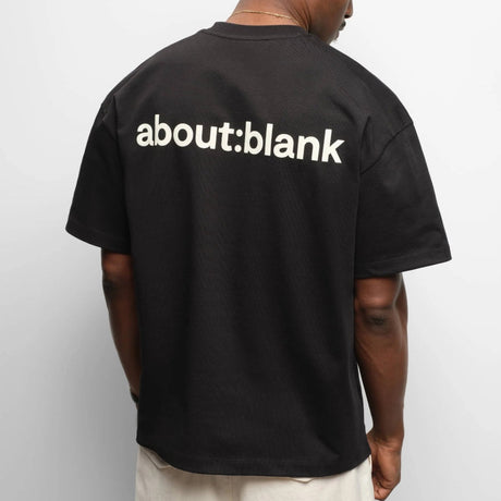 Black AboutBlank Reverse Blank Tee shirt for casual wear, featuring a minimalist design and comfortable fit.