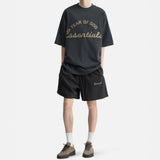 Fear of God Essentials Training 90s Shorts in faded black, casual athletic apparel with a relaxed fit and comfortable fabric.