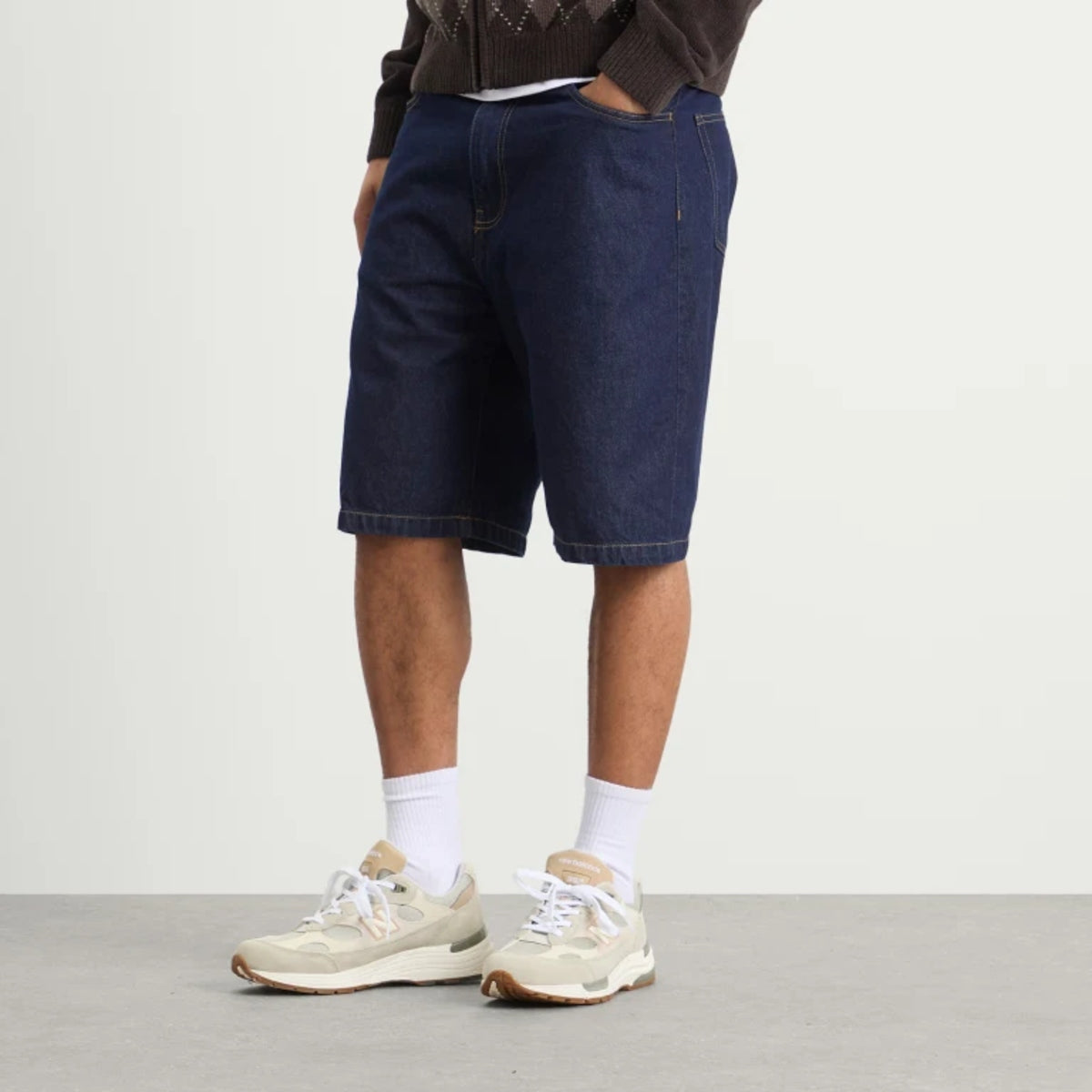 Carhartt WIP Landon loose fit denim shorts in blue rinse, casual men's apparel with distressed details and belt loops.