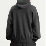 Fear of God Essentials Training 90s Heavyweight Hoodie in iron gray, featuring a relaxed fit and branding details.