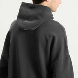 Fear of God Essentials Training 90s Heavyweight Hoodie in iron gray, showcasing the soft, chunky fabric and classic fit.