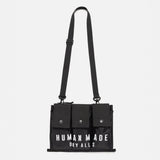 Black Human Made military shoulder bag with adjustable strap and multiple compartments, designed for versatile carrying.