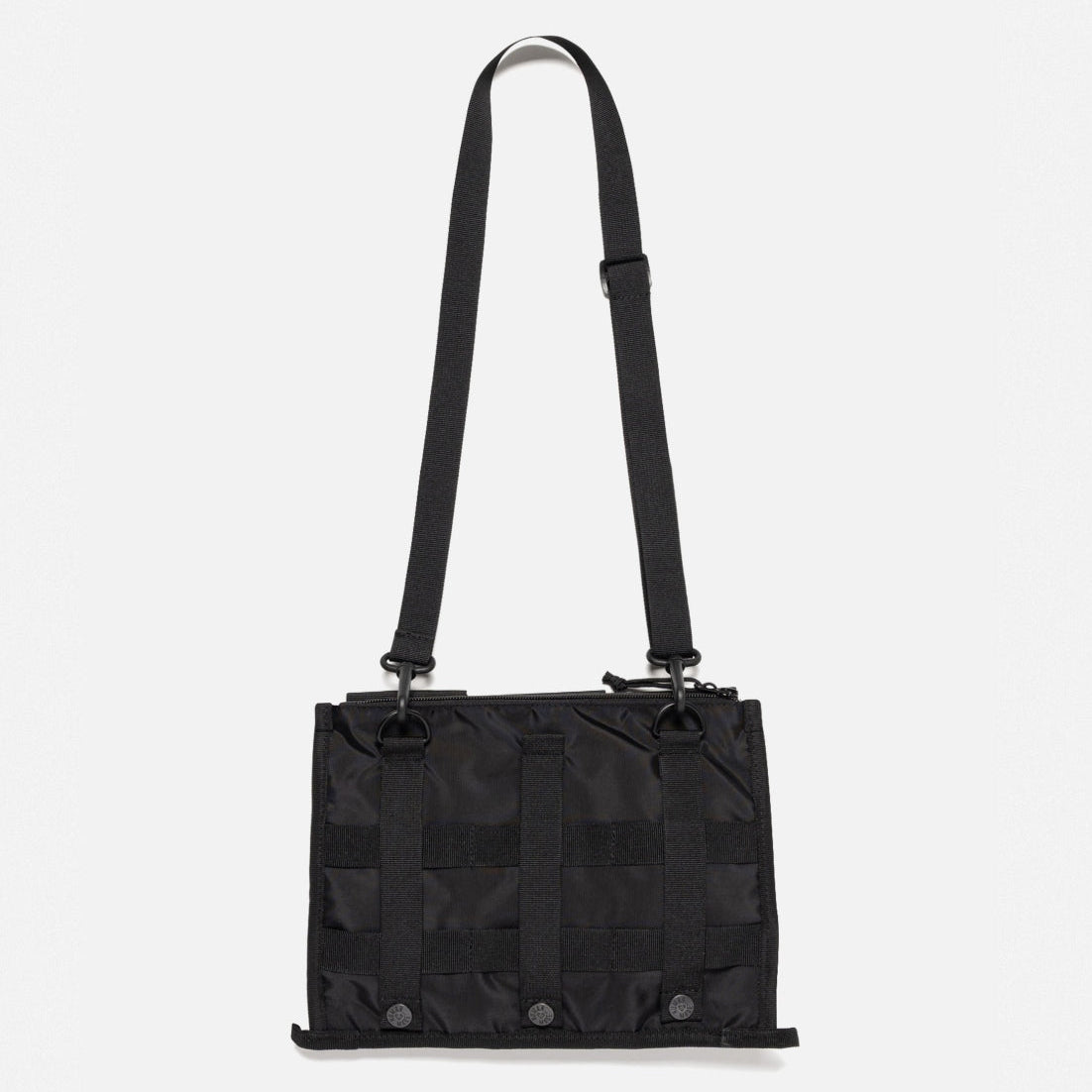 Human Made black military shoulder bag with adjustable strap and multiple compartments, designed for casual and tactical use.