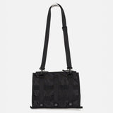Human Made black military shoulder bag with adjustable strap and multiple compartments, designed for casual and tactical use.