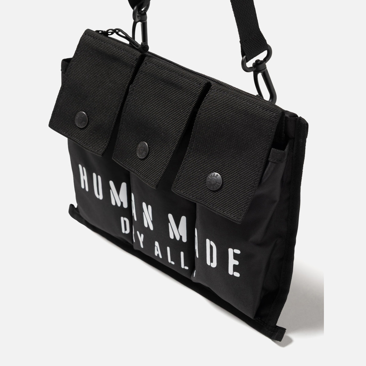 Black Human Made Military Shoulder Bag with adjustable strap and multiple compartments, designed for durable everyday use.