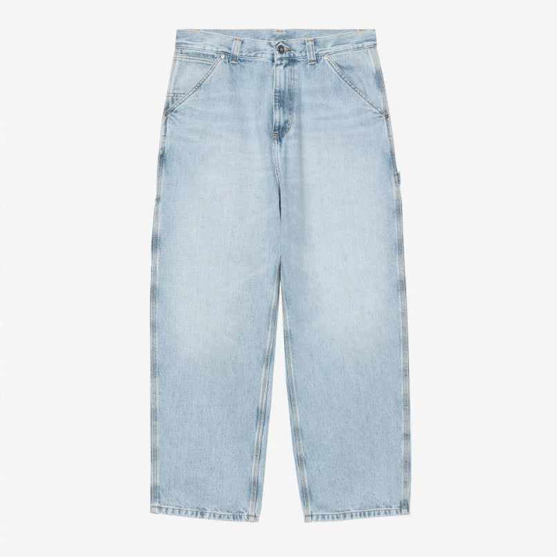 Carhartt WIP Belmont blue pants with a worn, bleached look, showcasing casual men's apparel in a close-up image.