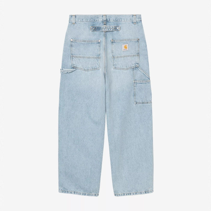Carhartt WIP Belmont pants in worn bleached blue, displaying relaxed fit denim with distressed detailing and classic five-pocket style.