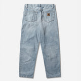 Carhartt WIP Aaron Pants in blue with burst washed finish, casual men's workwear apparel, front view showing fit and fabric details.