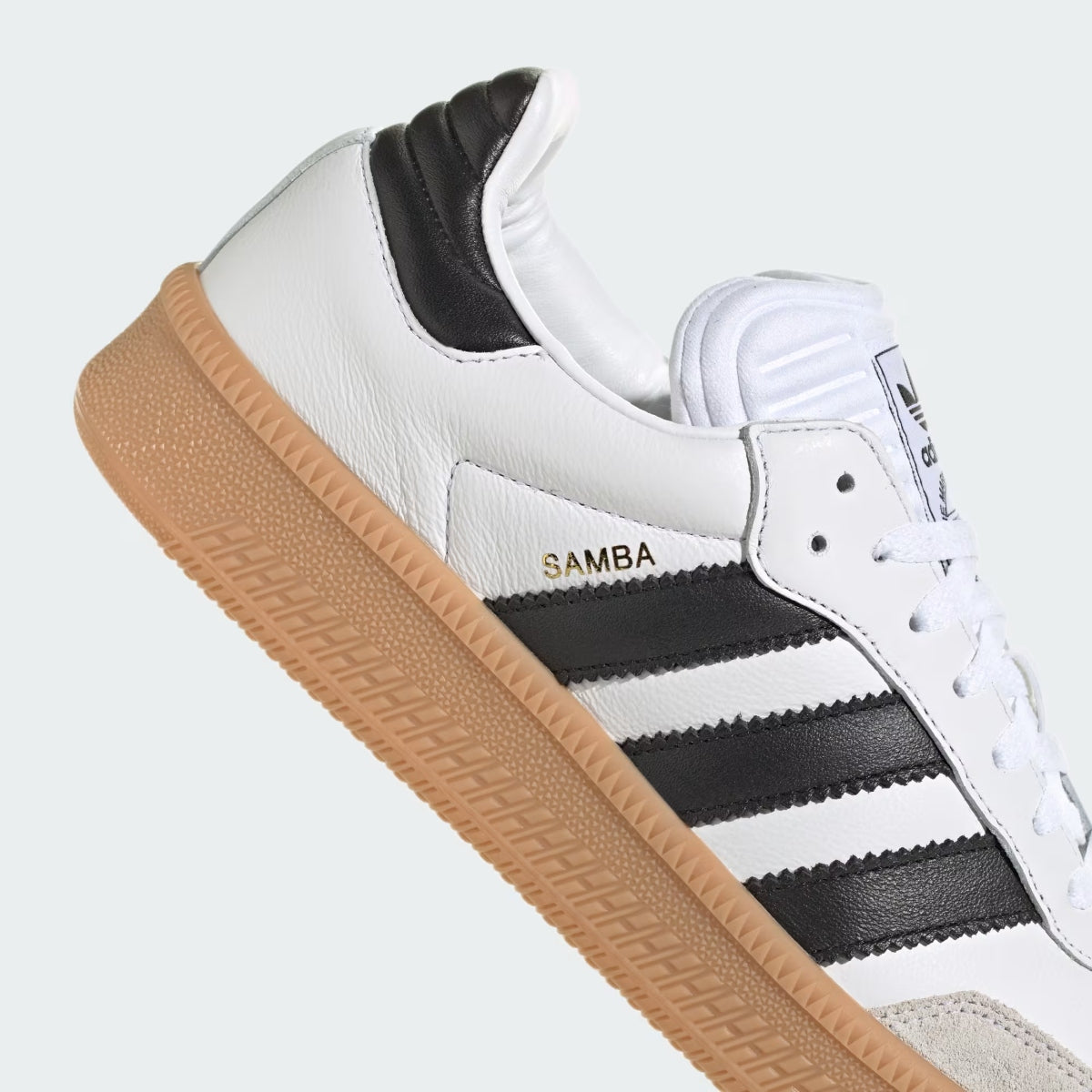 Adidas Originals Samba XLG sneakers in Cloud White, Core Black, and Gum with classic low-top design and textured rubber outsole.
