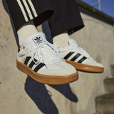 Adidas Originals Samba XLG sneakers in cloud white, core black, and gum with classic low-top design and leather upper.