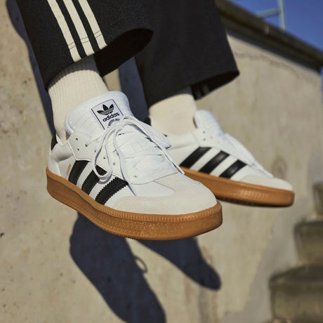Adidas Originals Samba XLG sneakers in cloud white, core black, and gum with classic low-top design and leather upper.