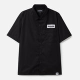 Black NEIGHBORHOOD classic work short sleeve shirt displayed flat, showing its casual design and durable fabric.