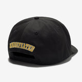Black Undefeated 5 Logo snapback hat with flat brim and adjustable strap, featuring the brand's iconic logo on the front.