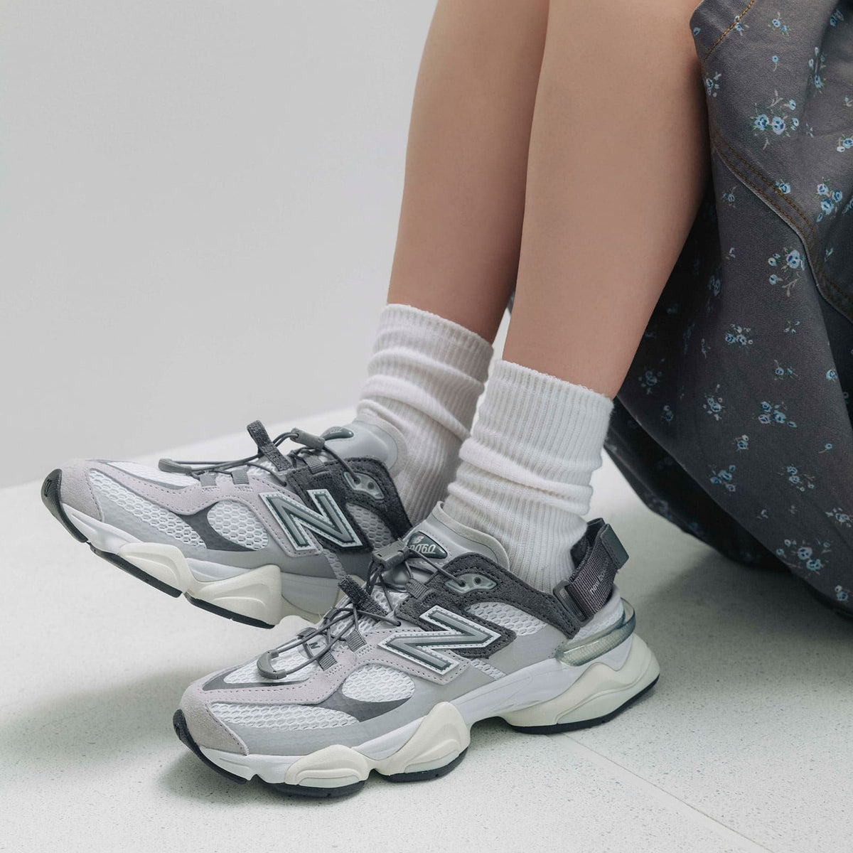 New Balance 9060 Mule Raincloud Castlerock sneakers featuring a sleek design and durable rainproof material, viewed from the top.