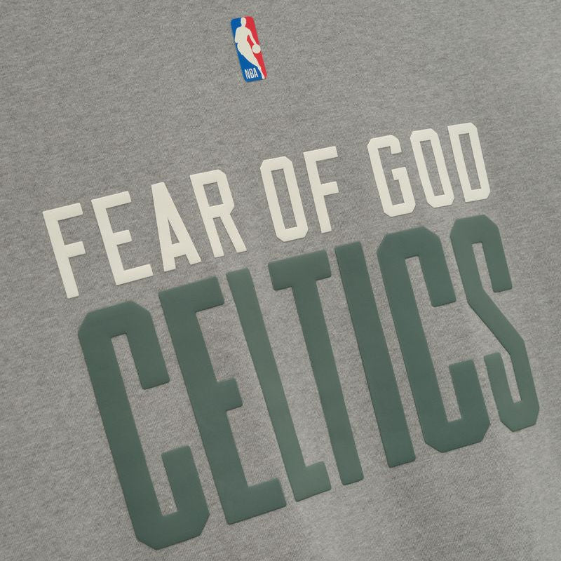 Fear of God Essentials NBA Celtics 90s heavyweight tee in concrete, featuring bold Celtics logo and vintage-inspired design.