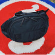 Black Ramidus Japan waist bag with adjustable strap and sleek design, perfect for casual wear and storage.